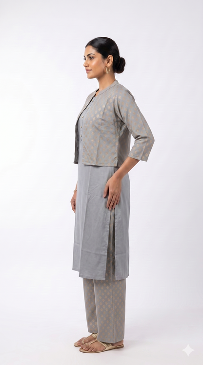 Woman wearing a gray patterned outfit on a white background