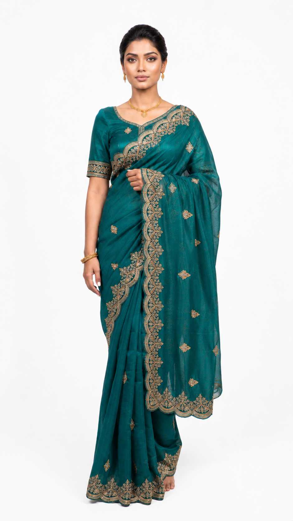 Teal saree with gold embroidery on a white background